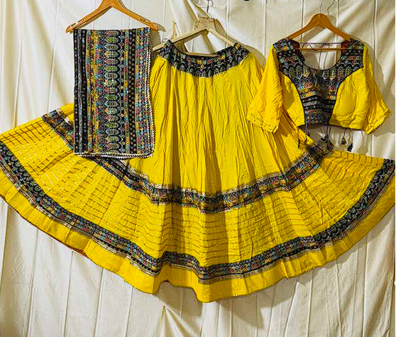 Vibrant Yellow Dandiya Dress with Colorful Traditional Motifs